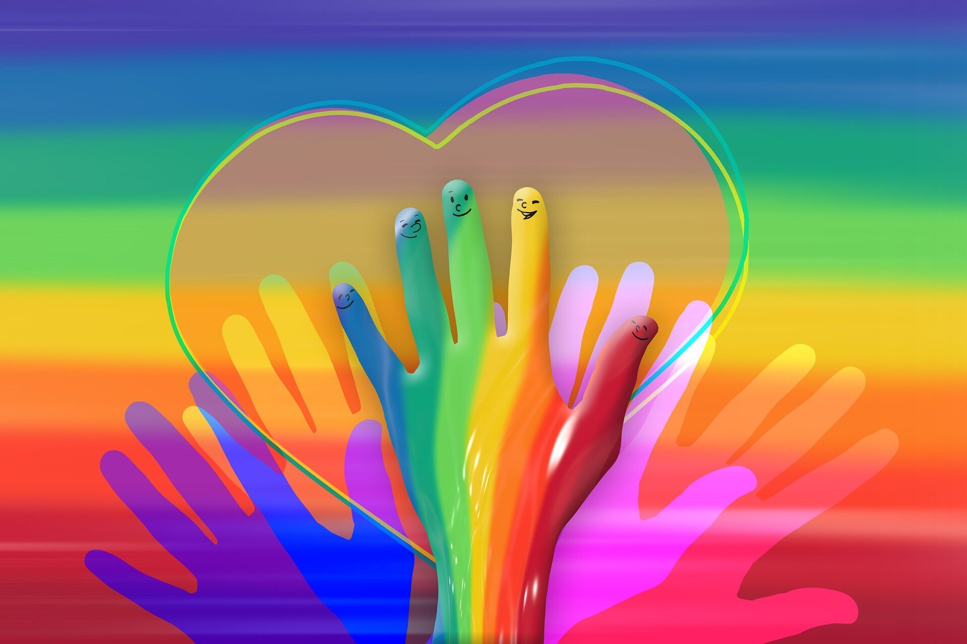 Hände in Regenbogenfarben mit einem Herz