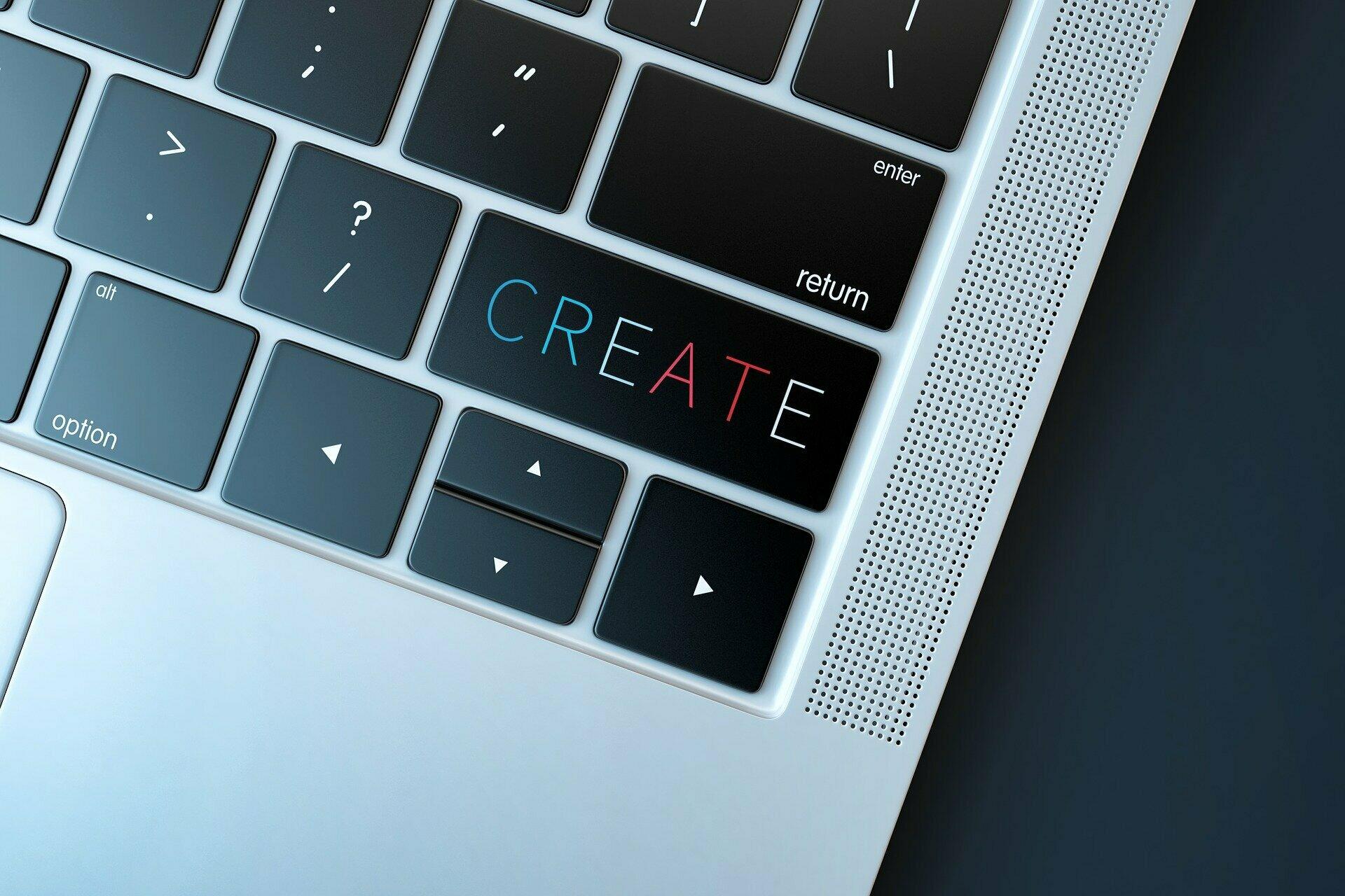Ausschnitt einer Laptop-Tastatur mit einem Button mit der Aufschrift "Create".